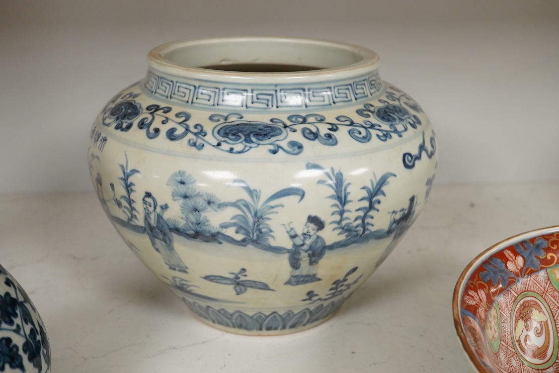 A pair of Chinese blue and white pear shaped vases, a similar jar and a Japanese bowl, largest 23cm in diameter